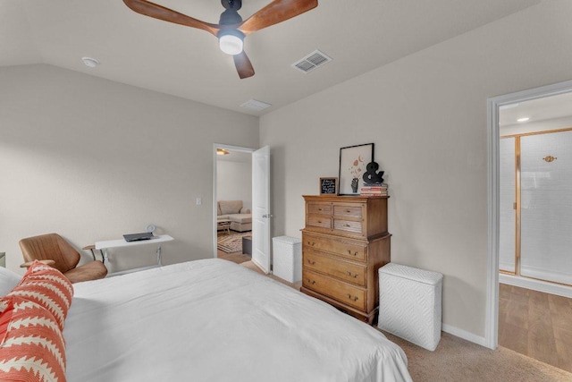 bedroom with a ceiling fan, carpet, visible vents, baseboards, and vaulted ceiling