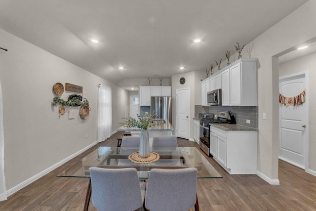 dining room featuring recessed lighting, baseboards, and dark wood-style floors