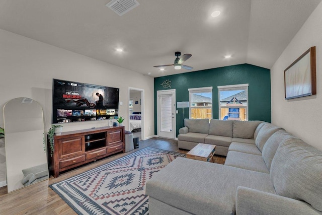 living area with visible vents, lofted ceiling, recessed lighting, ceiling fan, and light wood-style floors