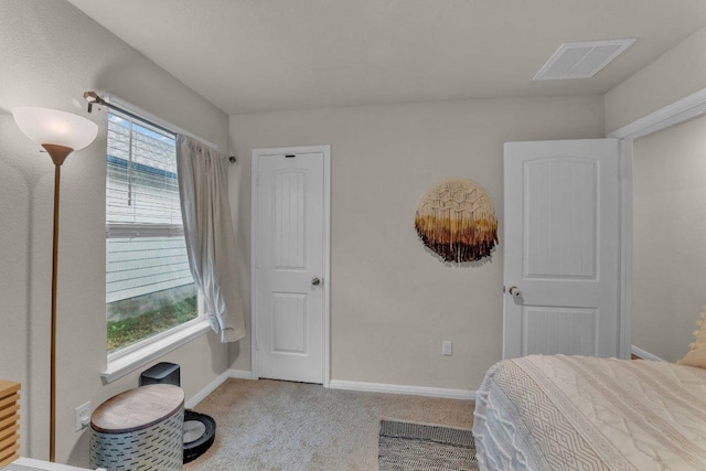 bedroom with visible vents, baseboards, and carpet floors