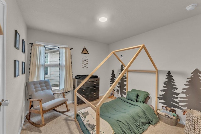 bedroom with baseboards and carpet floors