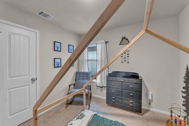 carpeted bedroom featuring visible vents and baseboards