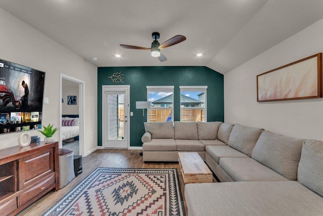 living area with wood finished floors, baseboards, recessed lighting, ceiling fan, and vaulted ceiling