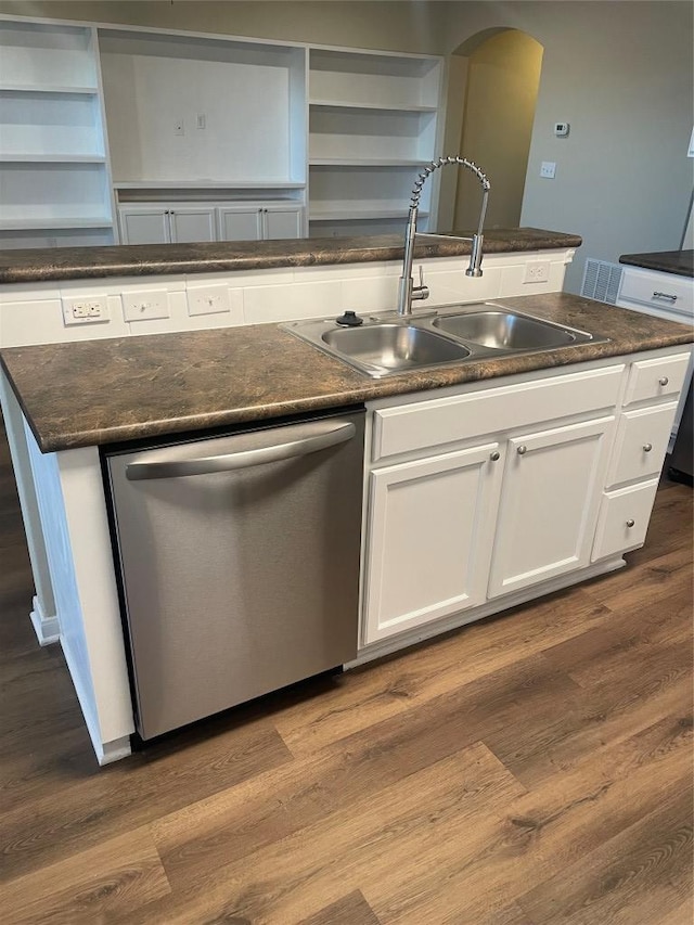 kitchen with dishwasher, a sink, open shelves, and dark wood finished floors