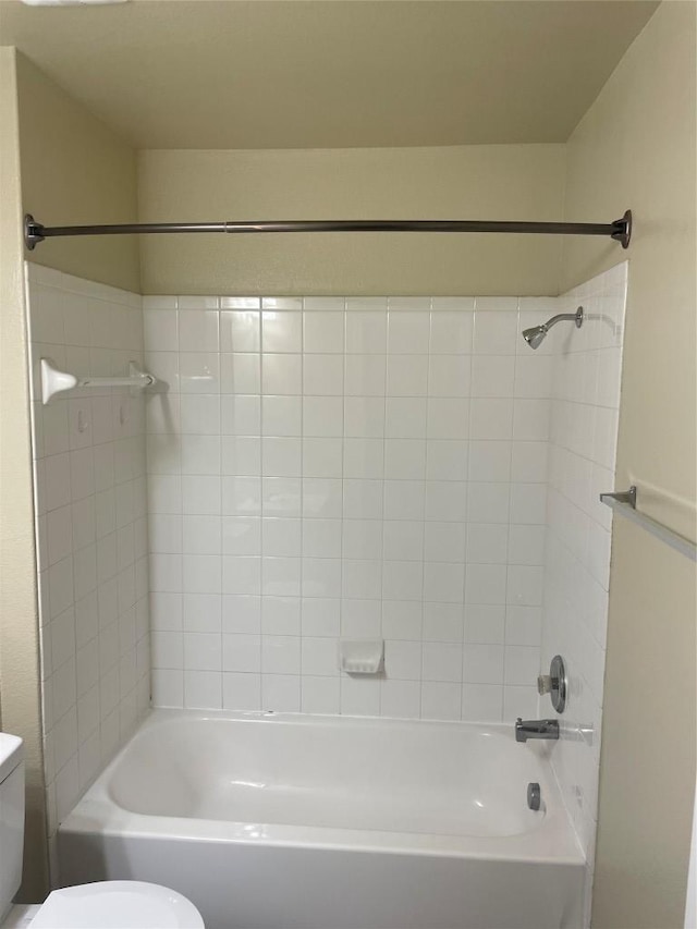 bathroom featuring toilet and shower / washtub combination