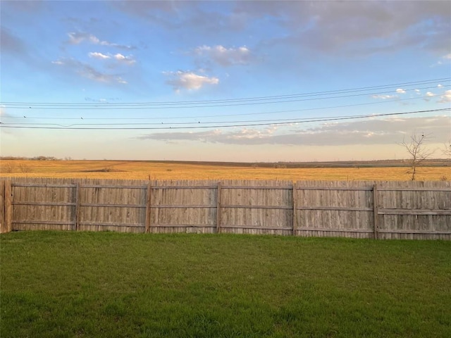 yard at dusk with fence