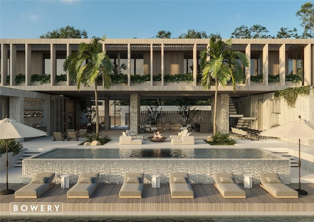 view of property featuring stairs and an outdoor fire pit