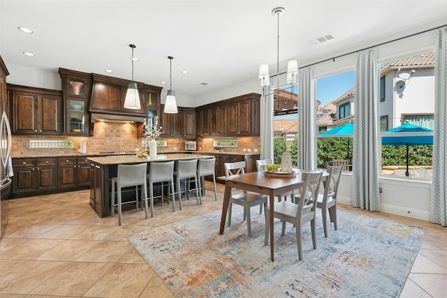 dining room with visible vents, recessed lighting, an inviting chandelier, light tile patterned flooring, and baseboards