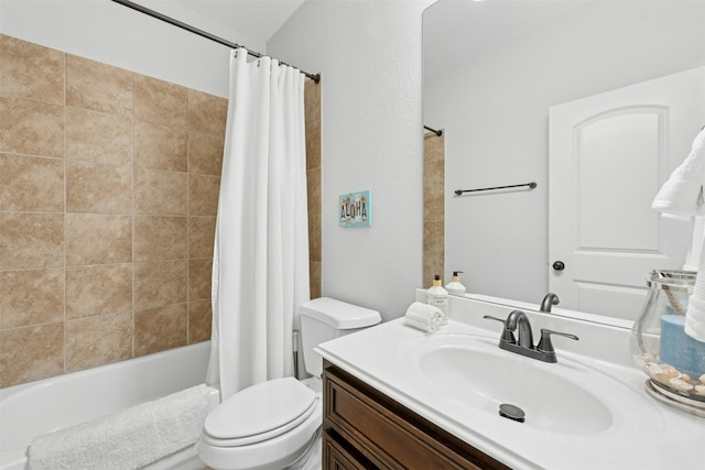 bathroom featuring toilet, vanity, and shower / bath combo