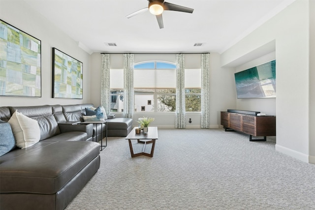 carpeted living room with visible vents, baseboards, and ceiling fan