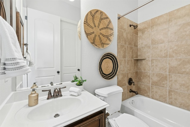 bathroom featuring vanity, bathing tub / shower combination, and toilet