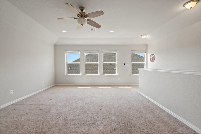 empty room featuring visible vents, plenty of natural light, and baseboards