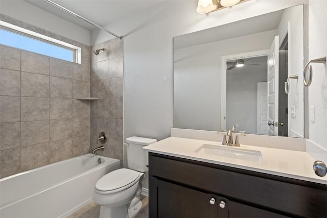 bathroom with toilet, bathtub / shower combination, and vanity