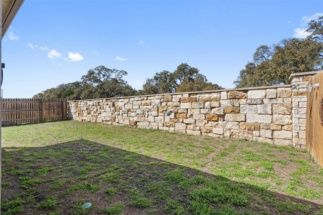 view of yard with a fenced backyard