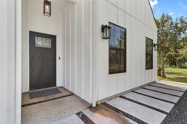 entrance to property featuring board and batten siding