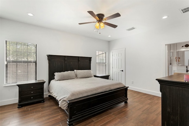 bedroom with visible vents, dark wood-type flooring, and baseboards