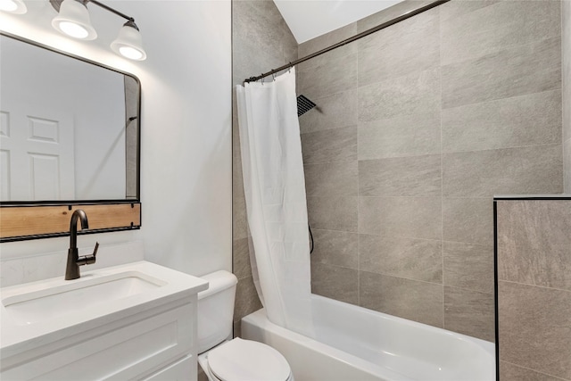 full bath featuring toilet, vanity, and shower / bath combo