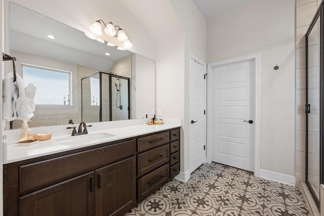 full bathroom featuring recessed lighting, baseboards, a stall shower, and vanity