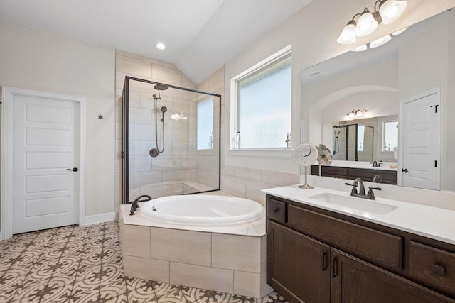 full bath with a stall shower, recessed lighting, lofted ceiling, a bath, and vanity