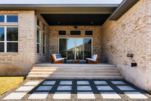 property entrance with brick siding