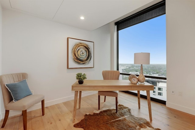 70 Rainey St Unit 1807, Austin, TX 78701 - office area with light wood-style floors, floor to ceiling windows, and recessed lighting