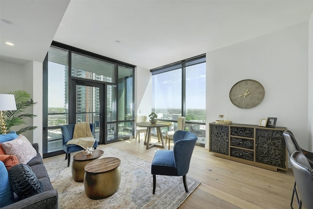 70 Rainey St Unit 1807, Austin, TX 78701 - living area featuring a wall of windows and wood finished floors