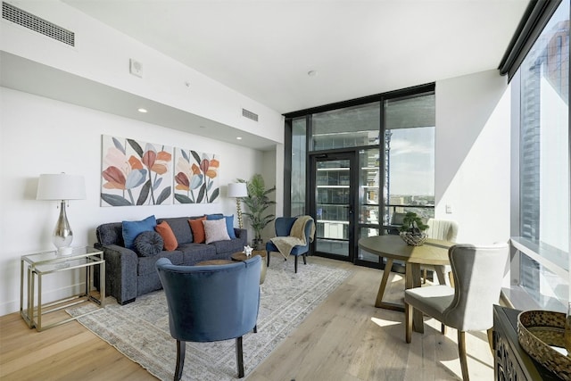 70 Rainey St Unit 1807, Austin, TX 78701 - living area with floor to ceiling windows and wood finished floors