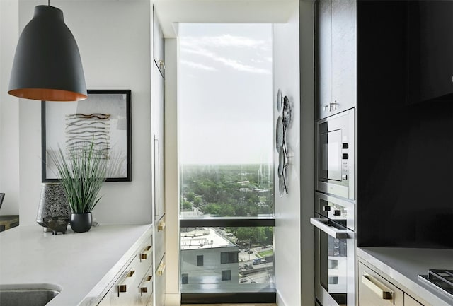 70 Rainey St Unit 1807, Austin, TX 78701 - kitchen featuring stainless steel appliances and light countertops