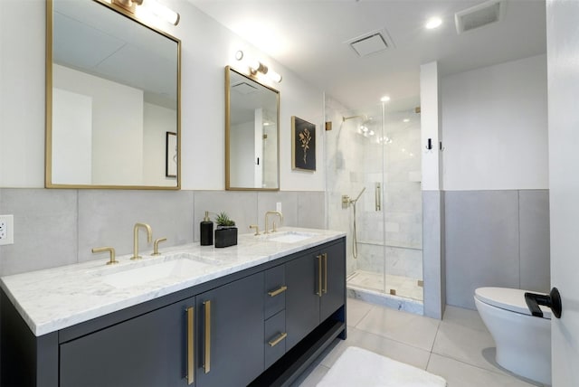 70 Rainey St Unit 1807, Austin, TX 78701 - bathroom featuring double vanity, a shower stall, and tile patterned floors