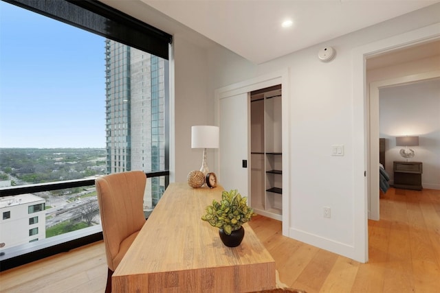 70 Rainey St Unit 1807, Austin, TX 78701 - dining area featuring wood finished floors and recessed lighting
