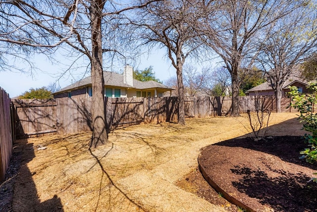 view of yard featuring a fenced backyard