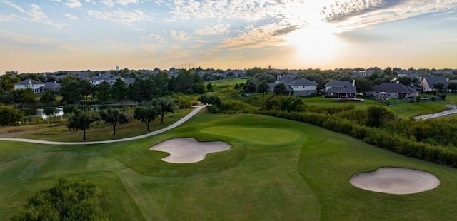 surrounding community with view of golf course