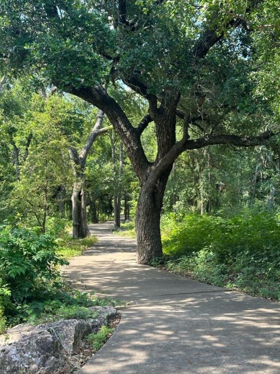 view of property's community with a forest view