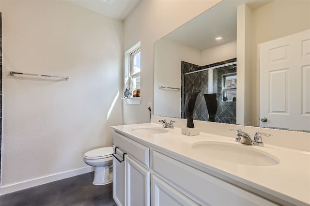 full bath with a stall shower, toilet, baseboards, and a sink