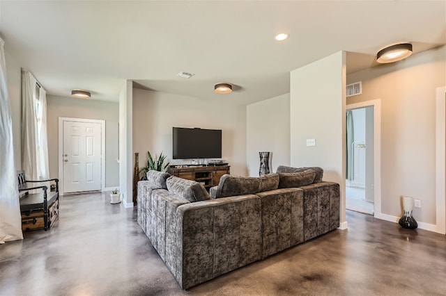 living area with recessed lighting, baseboards, visible vents, and concrete flooring