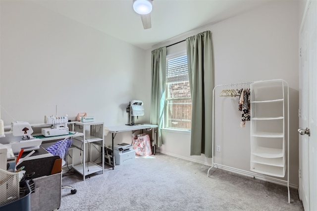 home office featuring carpet, baseboards, and ceiling fan