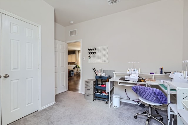 carpeted home office with visible vents