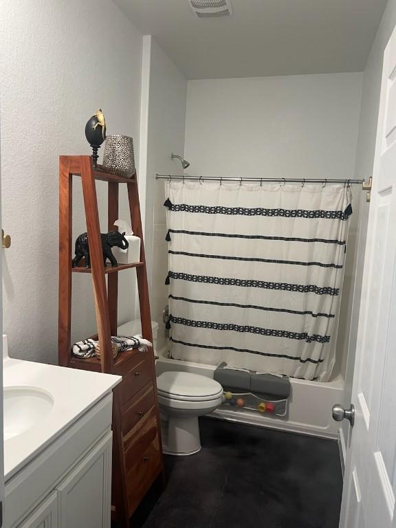 full bath with vanity, shower / tub combo, toilet, and visible vents