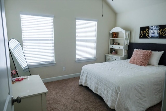 bedroom with baseboards, carpet, and vaulted ceiling