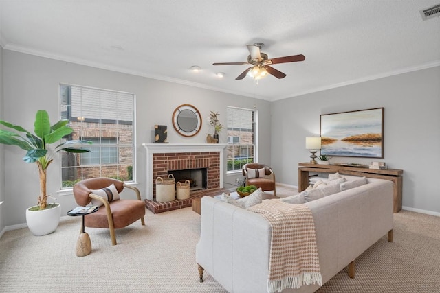 living room featuring a healthy amount of sunlight, crown molding, a ceiling fan, and carpet floors