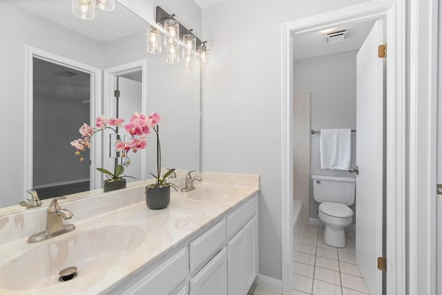 full bathroom featuring visible vents, double vanity, a sink, tile patterned floors, and toilet