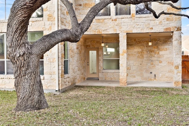 exterior space with stone siding