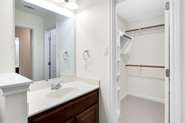 6717 Blissfield Dr, Austin, TX 78739 - bathroom featuring vanity and a walk in closet