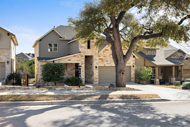 view of front facade featuring stone siding, concrete driveway, and a garage