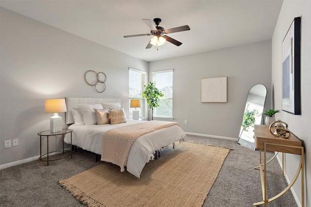 bedroom with ceiling fan, carpet, and baseboards