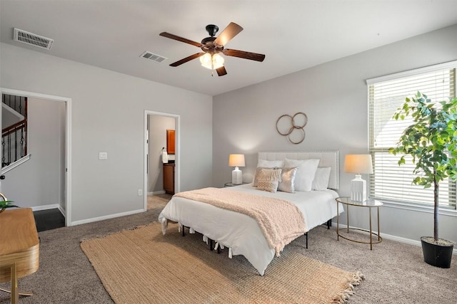 bedroom featuring baseboards, visible vents, carpet floors, and ceiling fan