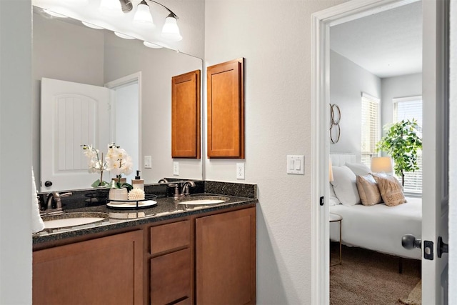 ensuite bathroom with double vanity, ensuite bathroom, and a sink