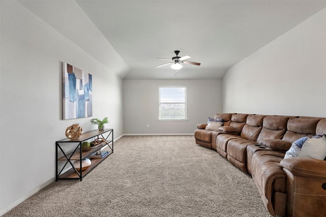 living room with baseboards, light colored carpet, and a ceiling fan