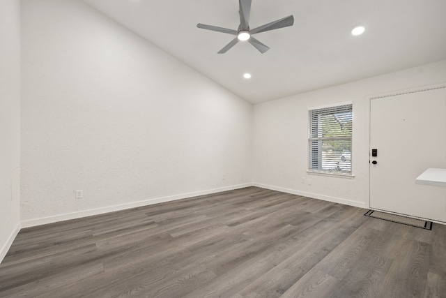 empty room featuring baseboards, dark wood finished floors, lofted ceiling, recessed lighting, and ceiling fan