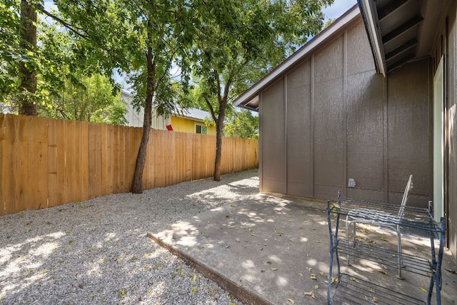 view of patio / terrace featuring fence